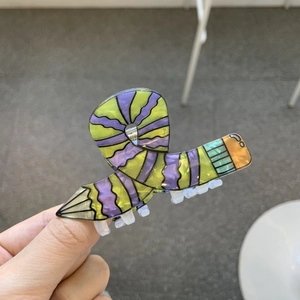 Creative pencil-shaped hair claw clip in candy yellow and purple striped acrylic design