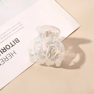 Detail of transparent iridescent hair claw clip with rainbow electroplated finish