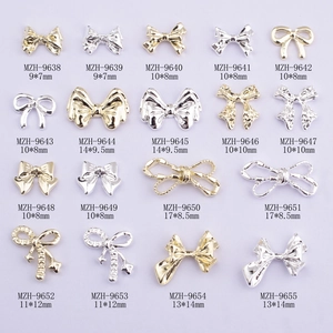 Collection of 18 styles of alloy bowknot nail charms in gold and silver finishes