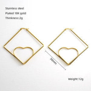 Detail of 50mm 18K gold plated stainless steel diamond hoop earrings with heart design