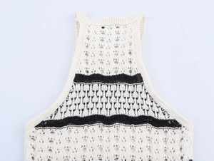 Close-up of cream knit halter top with black zigzag stripes and crochet texture details