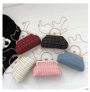 Detail of tweed crossbody bags with golden chain straps in multiple vibrant colors