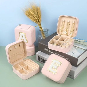Pink portable travel jewelry box with letter embroidery for rings and necklaces