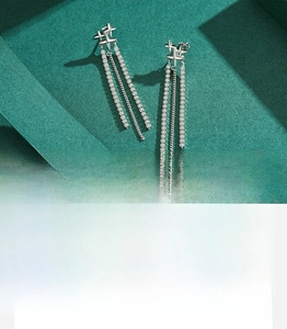 Macro detail of S925 sterling silver long tassel earrings with sparkling 5A cubic zirconia
