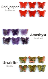 Macro view of crystal butterflies in red jasper, amethyst, and unakite stones