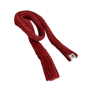 Deep red ribbed knit wool scarf with a minimalist white woven label for winter styling