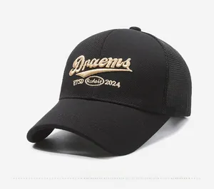 Detail of Dreams 2024 gold embroidery on black mesh trucker cap with breathable back