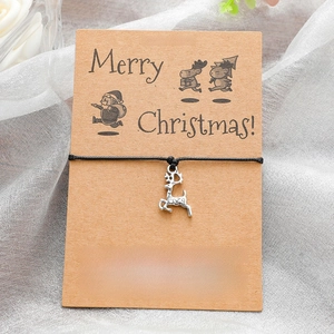 Christmas wish bracelet with silver reindeer charm on black cord with kraft card