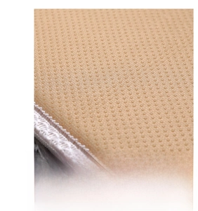 Detail of thickened non-slip backing with anti-skid dots and fine white stitched edges