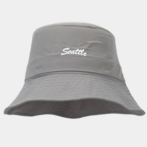 Detailed close-up of grey waterproof bucket hat featuring white Seattle embroidery