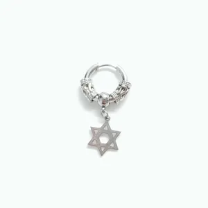 Macro shot of silver vintage star earring with intricate baroque carved floral clasp