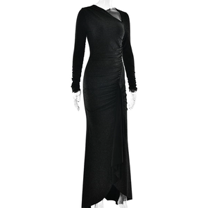 Detail of elegant black dress showing shimmering fabric texture and side slit