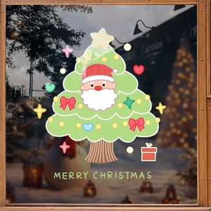 Christmas tree window sticker with Santa motifs and Merry Christmas text on glass