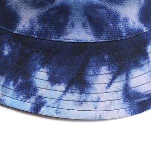 Detailed close-up of blue tie-dye bucket hat showing reinforced stitching and cotton texture