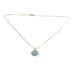 Detail of gold necklace with blue moon and star pendant and lobster clasp closure