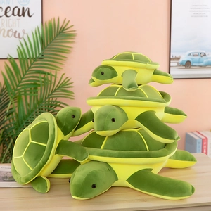 Cute green plush turtle stuffed animals in various sizes stacked in a cozy room