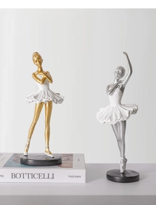 Artistic ballet girl statues with white pleated skirts and gold or silver accents
