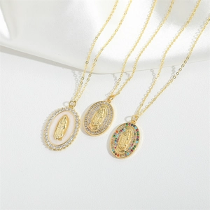 Gold plated Virgin Mary oval pendant necklaces with colorful cubic zirconia on white silk