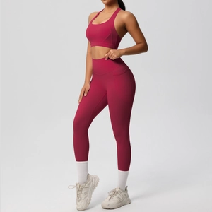 Detail of burgundy yoga set featuring high-waist leggings with side pockets and sports top