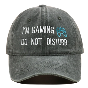 Detailed view of the gaming theme embroidery on a vintage grey washed cotton baseball cap