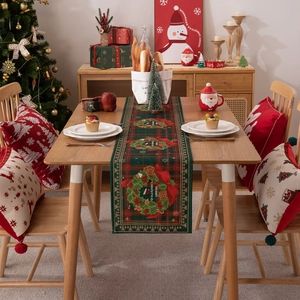 Festive Christmas table runner with red green plaid pattern and matching pillow covers