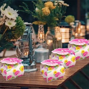 Hawaiian hibiscus floral gift boxes set on wooden table for summer tropical party decor