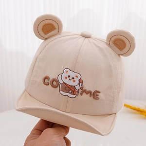 Close-up of beige baby baseball cap featuring cute 3D bear ears and embroidery detail