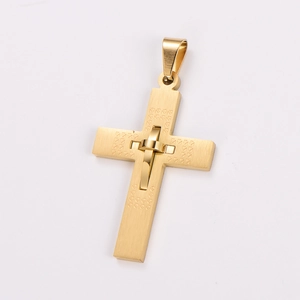 Detailed macro view of a gold stainless steel cross pendant with brushed metal texture