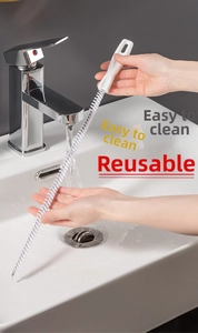 Flexible drain cleaning brush removing hair and debris from a bathroom sink drain