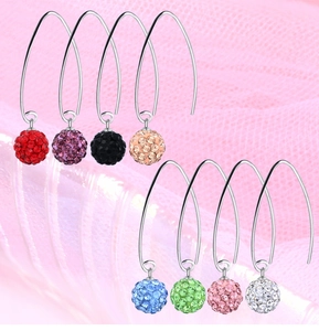 Macro shot of silver drop earrings with crystal pavé balls in eight vibrant colors
