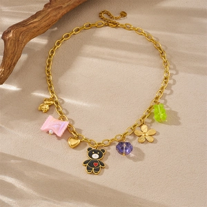 Gold-plated chain necklace with colorful candy, bear, heart, and flower charms