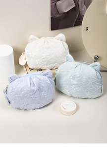 Detailed view of cat ear storage bags in lace floral jacquard fabric and shell shape