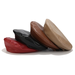 Faux leather beret hats for women in red, black, brown and beige colors on white background