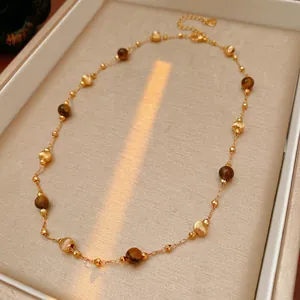 Gold plated tiger eye beaded necklace with adjustable chain and heart pendant