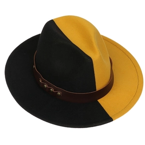 Detail of two-tone black and yellow wool fedora hat with brown leather band and studs