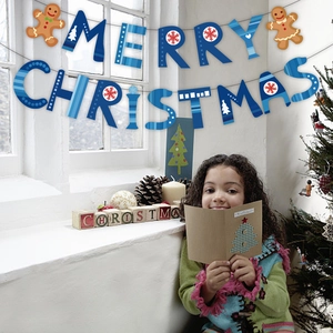Blue Merry Christmas banner with snowflake patterns hung for festive party decoration