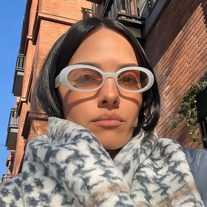 Retro oval white sunglasses with warm lenses and plush tie-dye scarf for outdoor fashion