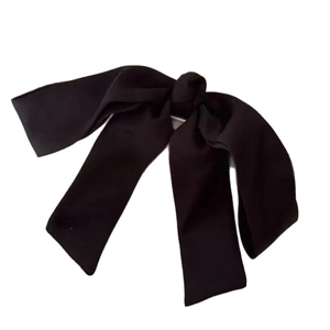 Large black satin bow hair clip for elegant low bun hairstyle and ponytail styling