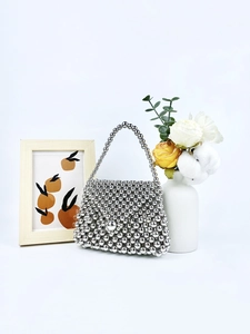 Handmade silver metallic beaded handbag with top handle for parties and elegant evening events