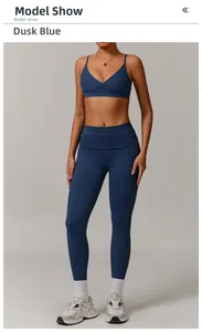 Dusk Blue yoga set featuring a V-neck sports bra and high-waisted leggings in a studio shoot