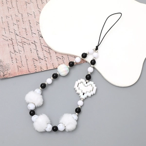 Phone strap with plush balls, pixel heart pendant, and black white beads for CCD cameras