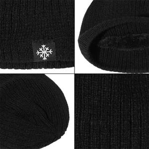 Close-up of black knitted beanie with thick fleece lining and snowflake patch detail