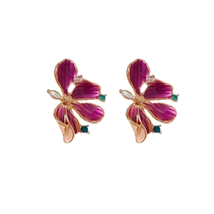 Floral stud earrings with purple enamel and glittering crystal accents in gold finish