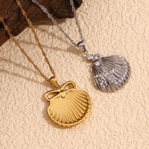 Scallop shell necklaces in gold and silver finish with star detail and rhinestones
