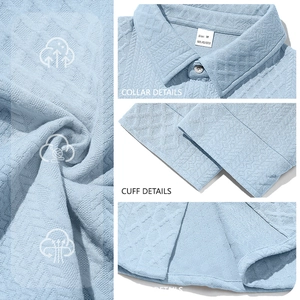 Macro detail of diamond waffle knit texture and 100% polyester fabric on light blue shirt