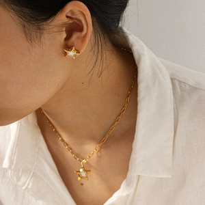 Golden stainless steel star necklace and earrings set with white enamel inlay for women