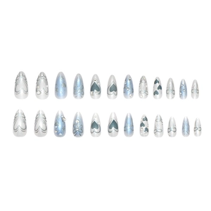 Dreamy blue pearlescent gradient press-on nails with silver hearts and bow designs