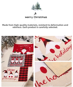 Close-up of Christmas placemats with cartoon gnomes and red black plaid borders