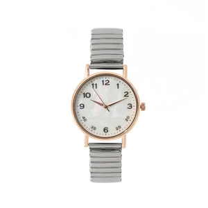 Montre quartz femme avec boîtier rond or rose et bracelet extensible argenté élastique