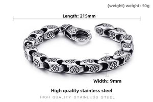 Detailed macro view of retro stainless steel bracelet with engraved floral oval links